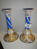 A pair of continental porcelain candlesticks.