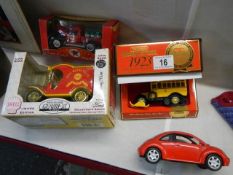 Three boxed die cast vehicle and a boxed Shell limited edition coin box.