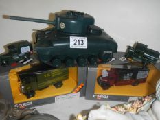 Two boxed Corgi Classics, a tank and two other die cast vehicles,.