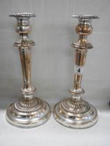 A pair of Sheffield plate candlesticks.