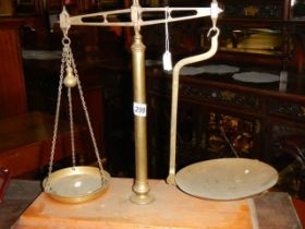 A set of brass balance scales.