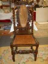 An old carved chair with cane seat and back, COLLECT ONLY.
