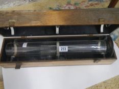 A wood cased glass measuring tube. COLLECT ONLY.