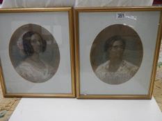 A pair of framed and glazed oval portraits of the Misses Makenzie of Seaforth, circa 1850's. COLLECT