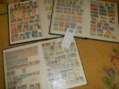 Three albums of postage stamps.