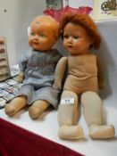 Two 1950's dolls with cloth bodies.