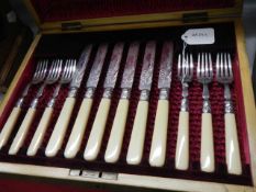 A cased set of six good quality knives and forks.