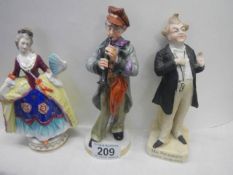A Mr Pickwick figure and two other figures.