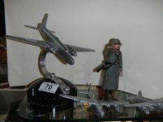 Three metal aircraft and a German soldier figure.