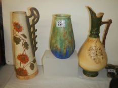 Two ceramic jugs and a vase.