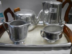A four piece vintage Piquot ware tea set on tray.