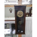 A mahogany wall clock, spring good and works but doesn't chime. COLLECT ONLY.