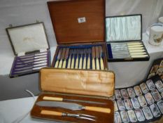 Four cased cutlery sets including carving set.