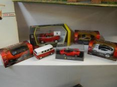 Five boxed and one unboxed die cast vehicles.