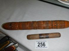 A wooden needle case and a knitting needle case.