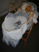 A doll in a Moses basket, COLLECT ONLY.