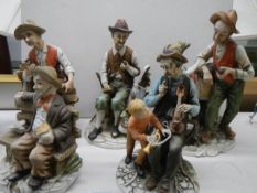 Five Capo-di-Monte style figures.