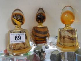 Three coloured glass scent bottles.