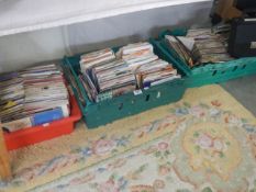 Three large trays of 45 rpm records.