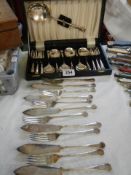 A cased desert set and a quantity of fish knives and forks.
