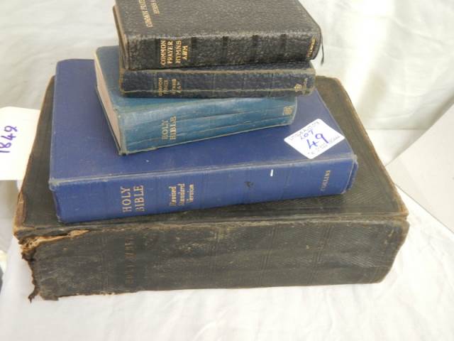 A large family Bible and other Bibles.