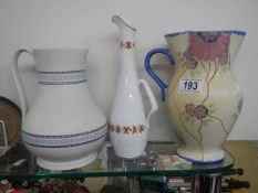 Three ceramic jugs.