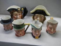 Six character jugs including Beswick.
