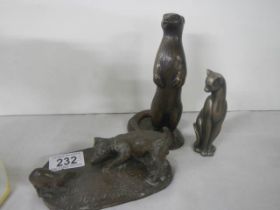 Four animal figures - dog, cat, otter and kiwi.