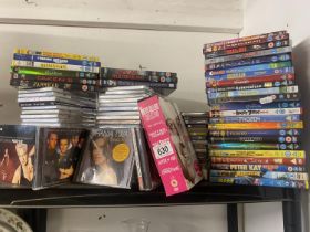 A quantity of DVD's and CD's