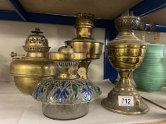 A Victorian Doulton Lambeth? oil lamp drop in font and others including Aladdin etc
