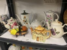 A quantity of teapots, including Gardening and Cottage ware teapots