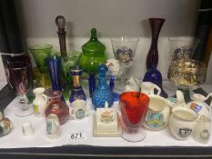A quantity of crested china, coloured glass ware etc