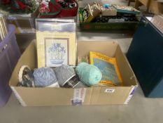 A quantity of cross stitch kits, wool and books