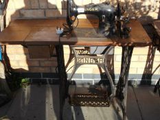 An Electric Treadle Cast Base Sewing Machine