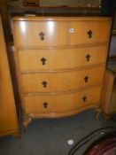 A good quality mid 20th century two over three serpentine chest of drawers, COLLECT ONLY.