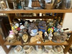 A shelf of mixed animal figures etc