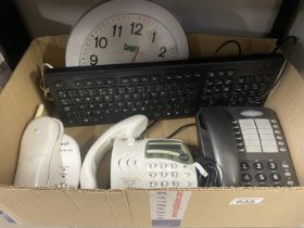 A quantity of telephones, keyboard and clock