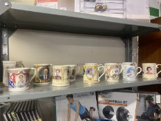 A quantity of commemorative mugs