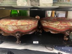 A pair of ornate Victorian style foot stools