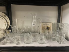 A quantity of glasses and a glass jug