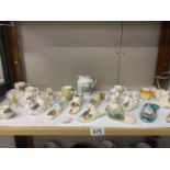 A good lot of mainly shoe ornaments including crested china etc