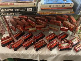 A good lot of red diecast buses etc