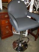 An adjustable bar chair with footrest, COLLECT ONLY.