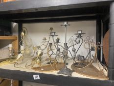 A selection of candle holders and electric light fittings