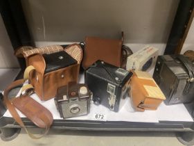 Two vintage Kodak Brownie cameras etc.,