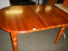 An oval pine kitchen table, COLLECT ONLY.