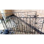 A pair of vintage wrought iron scroll gates 145w x 87H cm