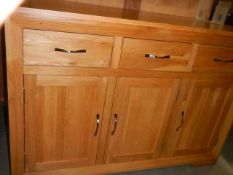 A good quality three door / three drawer oak sideboard, COLLECT ONLY.