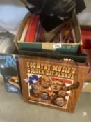 A box of vinyl records including Country music, Boney M, Elvis etc