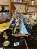 2 stained glass and metal tiffany style yachts and a small blown glass version